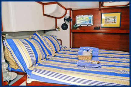 Large double bed in the Starboard suite.